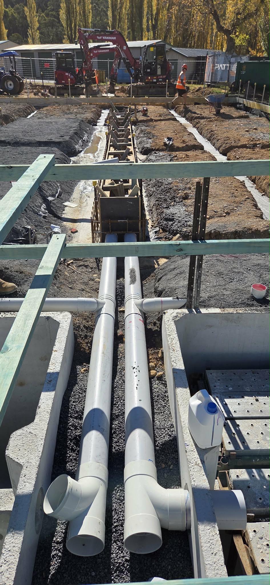 PVC pipework installed within a building construction site.